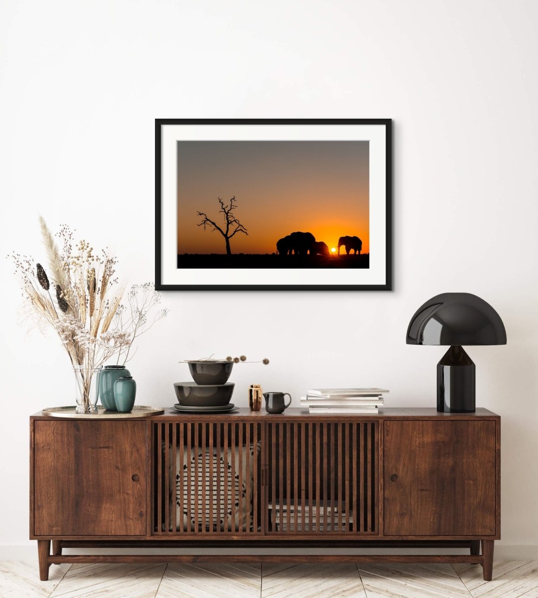 sunset wildlife with silouetted elephants and dead tree, Savuti, Botswana