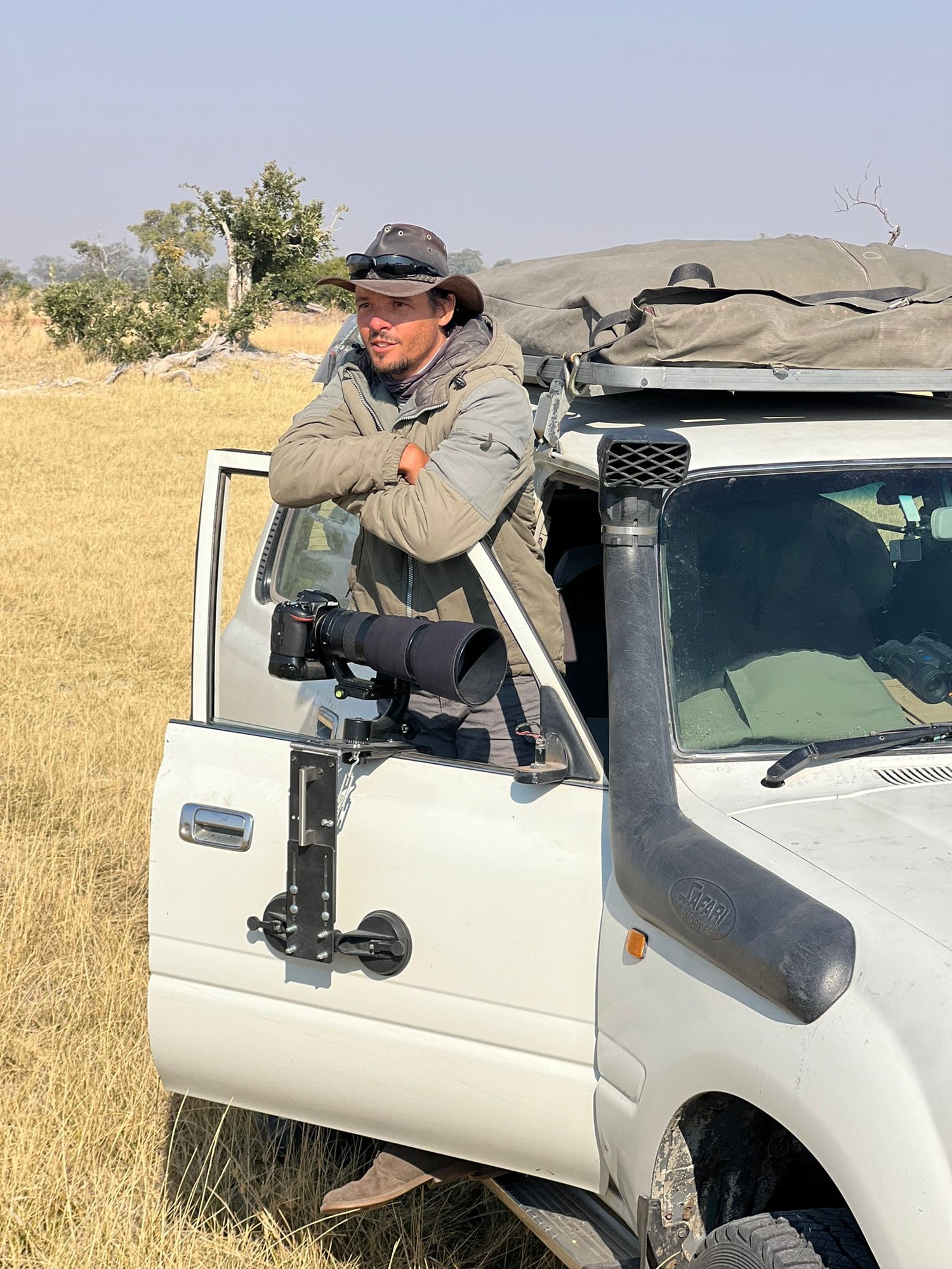 Person with a camera mounted on a vehicle in a natural setting